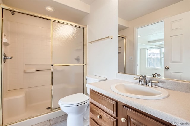 2561 Cactus Bluff Pl, Highlands Ranch, CO 80129 - bathroom featuring a shower stall, vanity, and tile patterned flooring