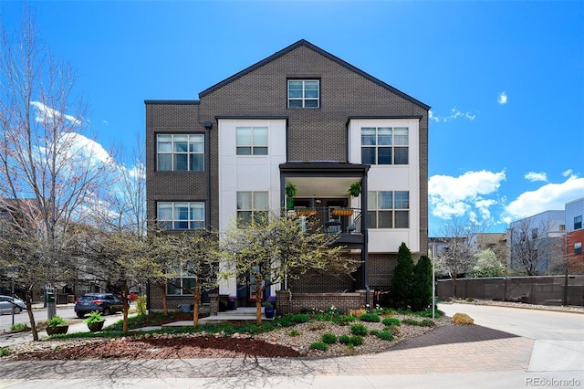view of front of property featuring brick siding