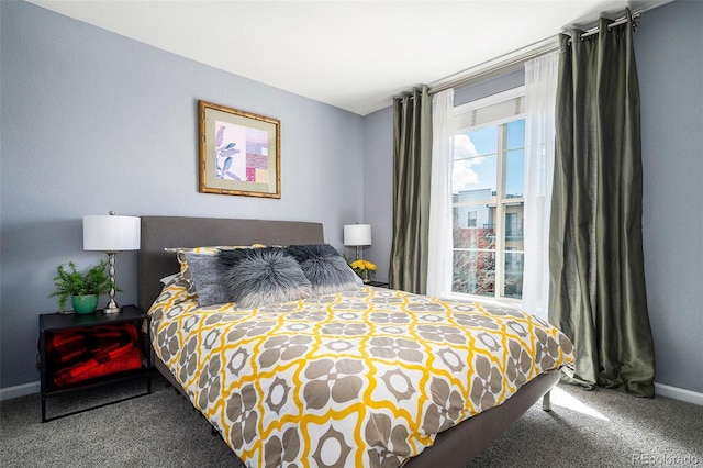 bedroom featuring baseboards and carpet flooring