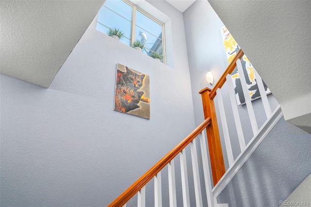 stairway with a high ceiling