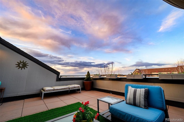 view of patio terrace at dusk