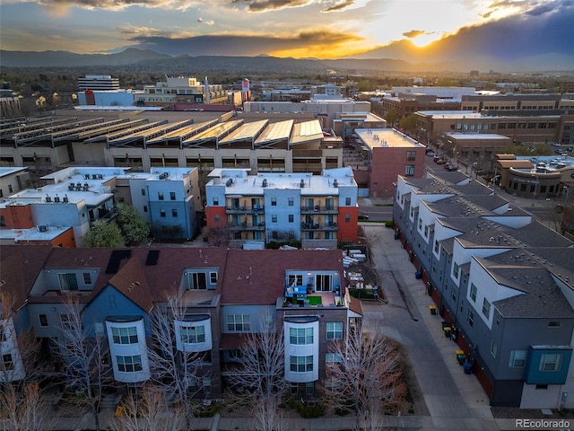 birds eye view of property featuring a mountain view