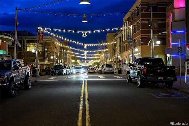 view of road featuring sidewalks and street lighting
