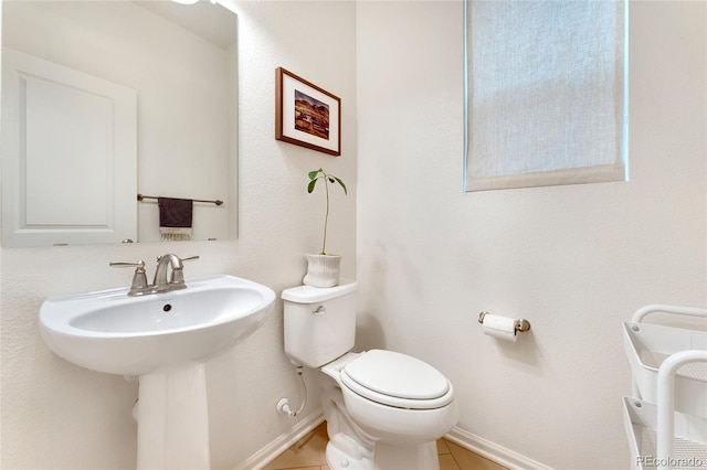 bathroom with sink, tile patterned floors, and toilet