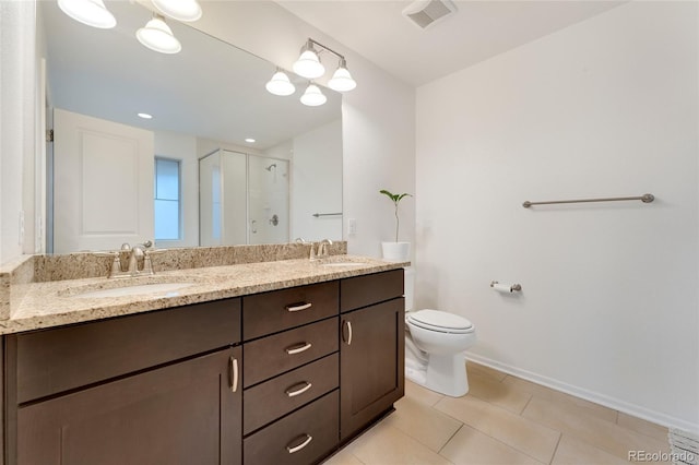 bathroom featuring vanity, toilet, tile patterned floors, and an enclosed shower