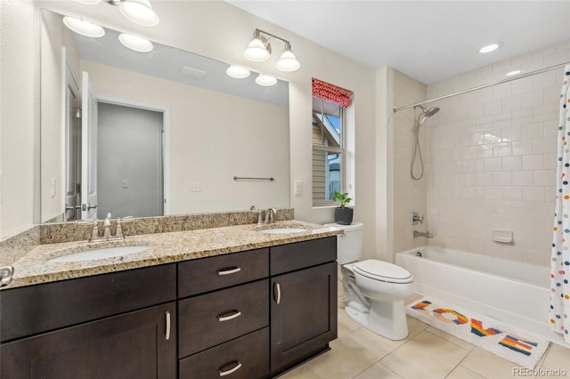 full bathroom featuring toilet, vanity, tile patterned flooring, and shower / bath combo