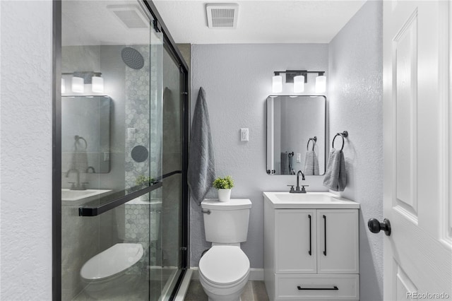 full bath featuring toilet, a stall shower, visible vents, and a textured wall