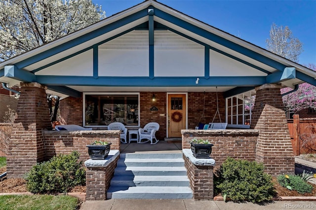 285 S Williams St, Denver, CO 80209 - view of front facade with covered porch and brick siding