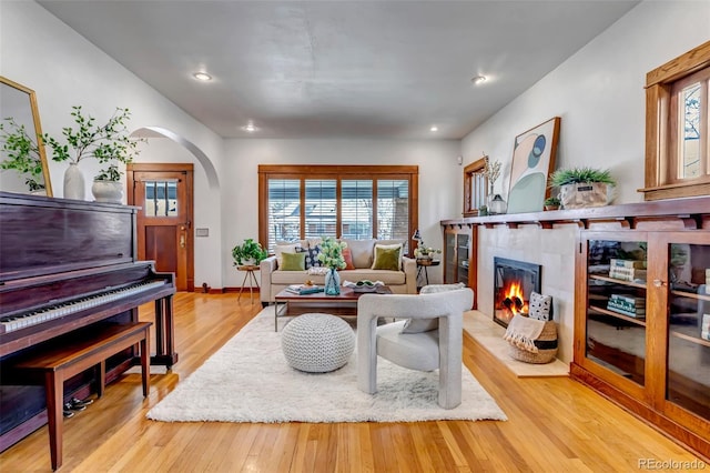 285 S Williams St, Denver, CO 80209 - sitting room with recessed lighting, wood finished floors, arched walkways, and a tile fireplace