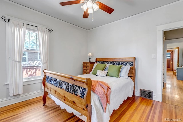 285 S Williams St, Denver, CO 80209 - bedroom with baseboards, crown molding, visible vents, ceiling fan, and wood finished floors
