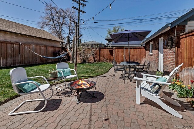 285 S Williams St, Denver, CO 80209 - view of patio / terrace featuring outdoor dining space, a fenced backyard, and an outdoor fire pit