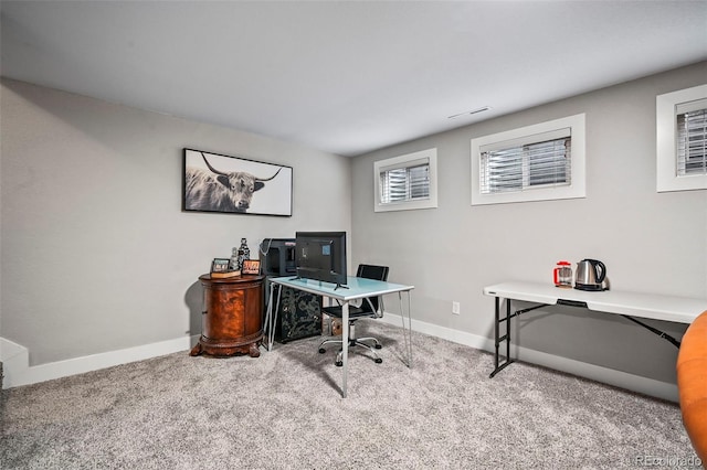 office area featuring carpet, visible vents, and baseboards