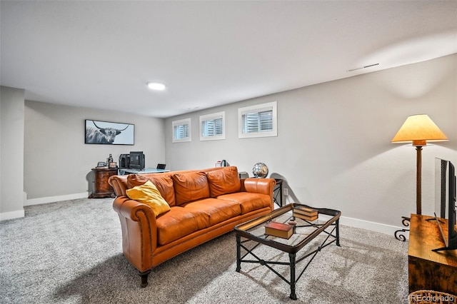 living area featuring carpet floors and baseboards