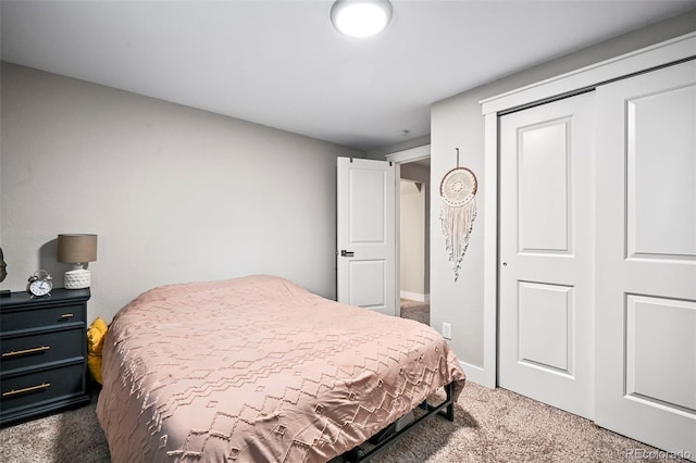 bedroom featuring a closet and carpet