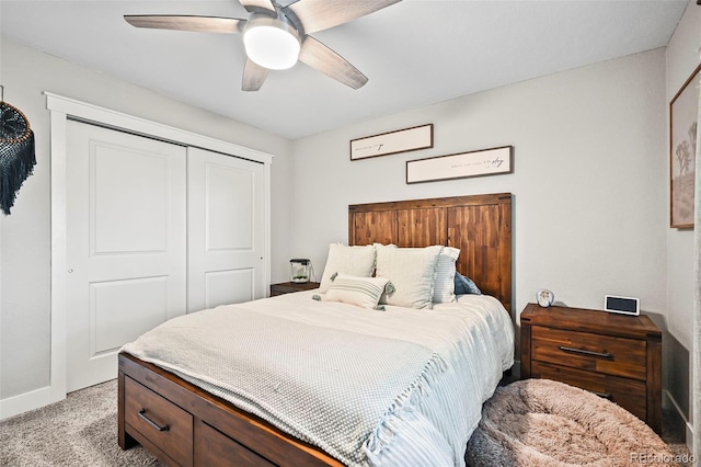 bedroom with light carpet, baseboards, a ceiling fan, and a closet