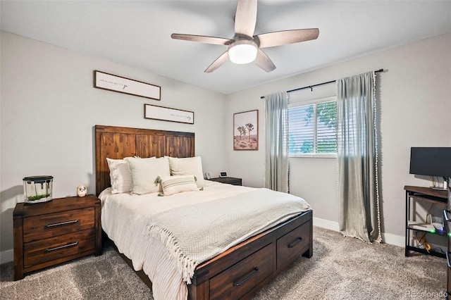 bedroom with ceiling fan, carpet floors, and baseboards