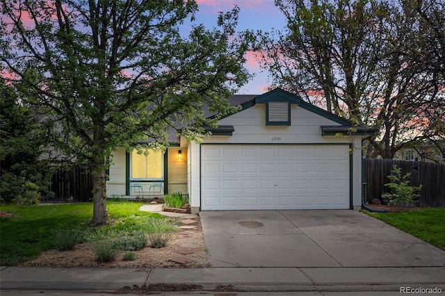 ranch-style house featuring driveway and an attached garage