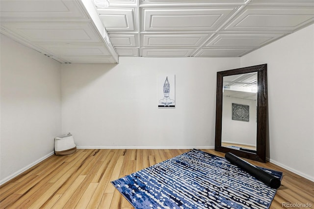 bedroom with wood finished floors and baseboards