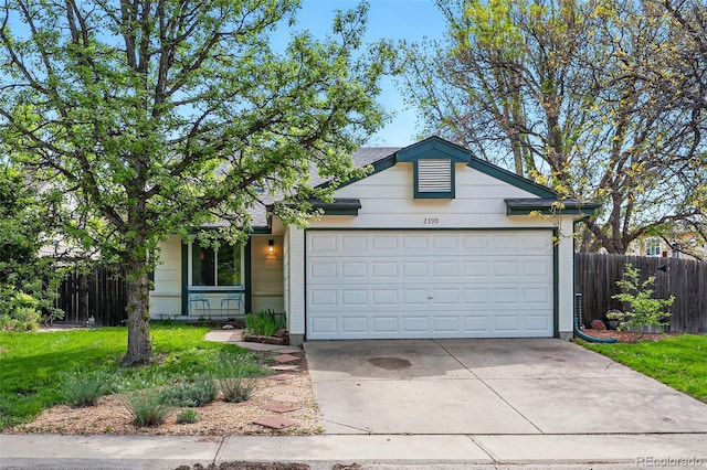 single story home featuring a garage and driveway
