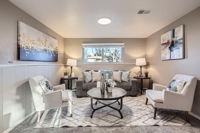 living room featuring visible vents