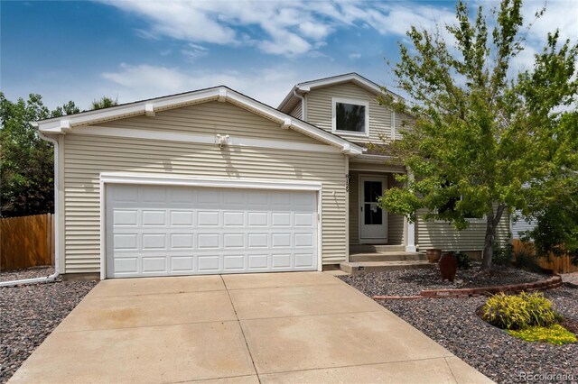 8129 Locust Dr, Littleton, CO 80125 - traditional-style house with an attached garage and driveway