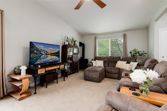 8129 Locust Dr, Littleton, CO 80125 - living room featuring a wood stove, carpet, a ceiling fan, and vaulted ceiling