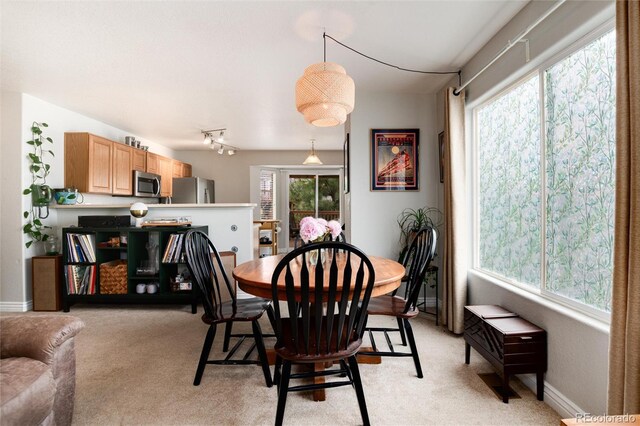 8129 Locust Dr, Littleton, CO 80125 - dining room with light colored carpet and baseboards