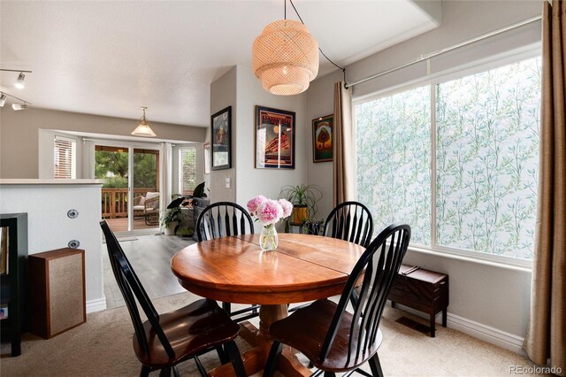 8129 Locust Dr, Littleton, CO 80125 - dining room featuring light colored carpet and baseboards