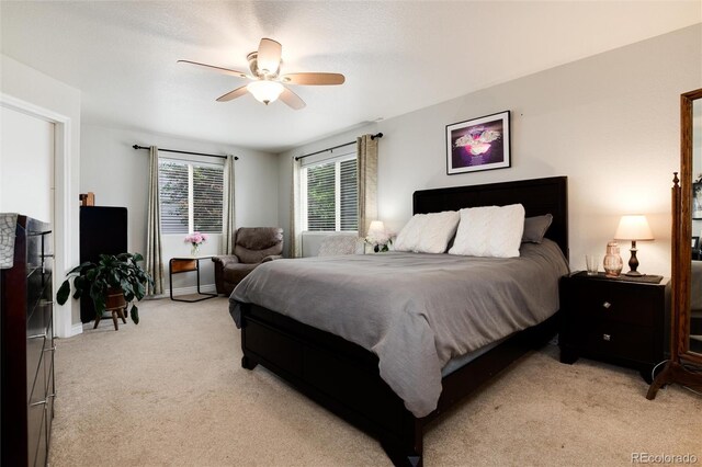 8129 Locust Dr, Littleton, CO 80125 - bedroom with light carpet and a ceiling fan