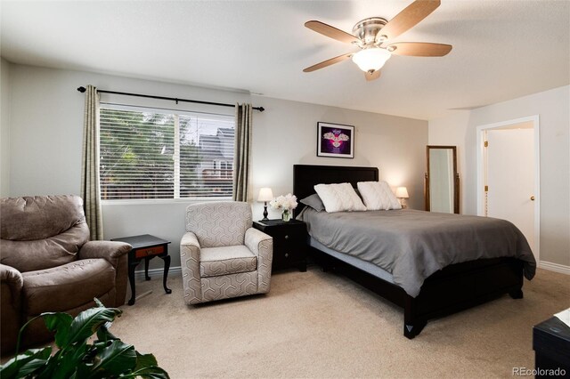 8129 Locust Dr, Littleton, CO 80125 - bedroom with light colored carpet, baseboards, and a ceiling fan
