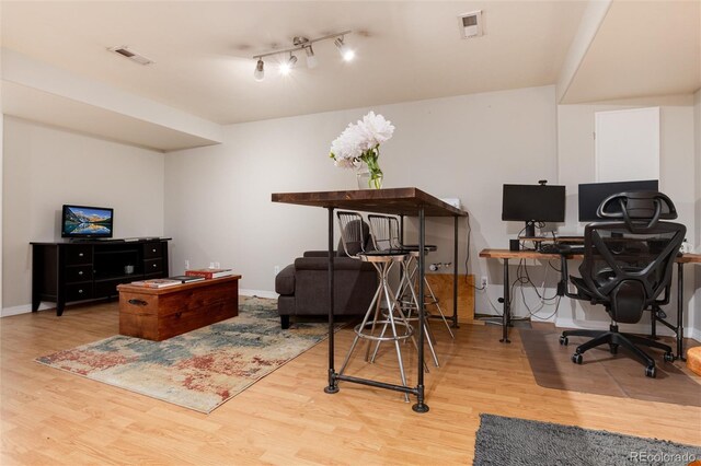 8129 Locust Dr, Littleton, CO 80125 - office space with wood finished floors, baseboards, and rail lighting