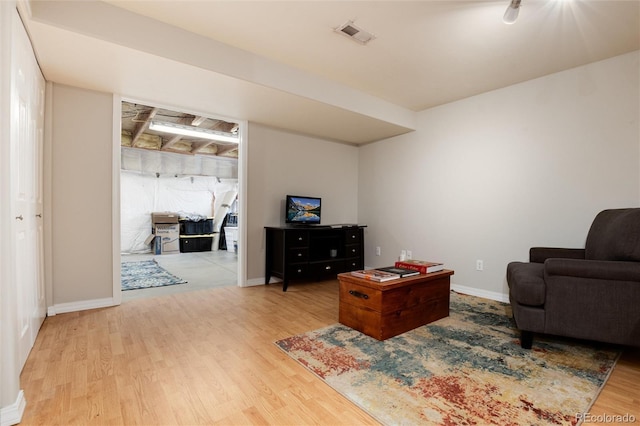 8129 Locust Dr, Littleton, CO 80125 - living area featuring wood finished floors and baseboards