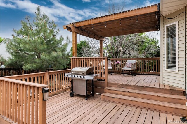 8129 Locust Dr, Littleton, CO 80125 - wooden deck with a grill