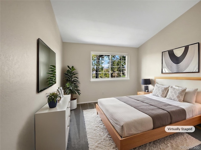 2418 W 82nd Pl Unit D, Westminster, CO 80031 - bedroom featuring carpet flooring, vaulted ceiling, and baseboards