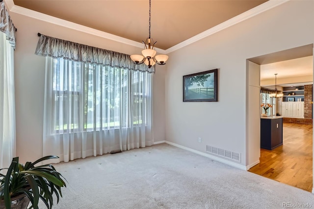 5305 W Lake Pl, Littleton, CO 80123 - carpeted spare room with an inviting chandelier, visible vents, baseboards, and crown molding