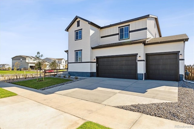 view of front of property with a garage and a front yard