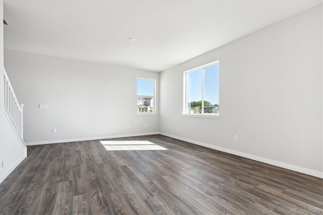 unfurnished room featuring dark hardwood / wood-style floors