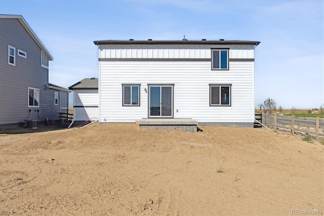 back of property with central AC unit