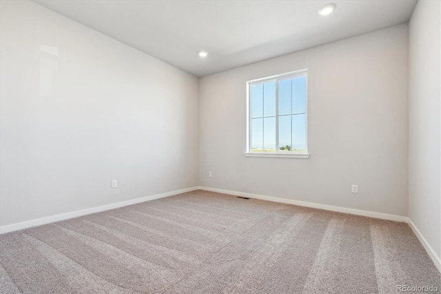 spare room with carpet