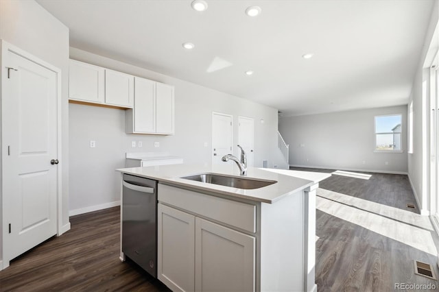 kitchen with an island with sink, dark wood-type flooring, white cabinetry, and dishwasher