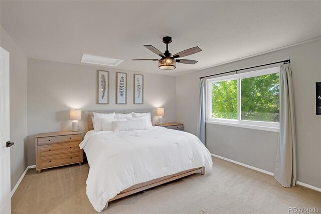 6488 Tilbury Ave, Firestone, CO 80504 - bedroom featuring baseboards, light carpet, and a ceiling fan