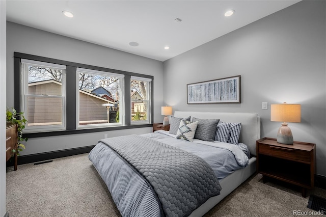 bedroom with recessed lighting, visible vents, and carpet