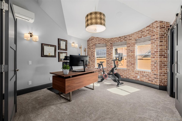 carpeted office featuring baseboards, brick wall, an AC wall unit, and lofted ceiling