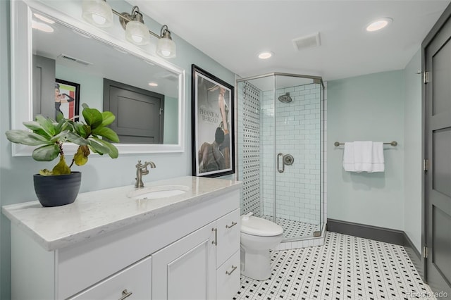 full bath featuring visible vents, a stall shower, toilet, and vanity