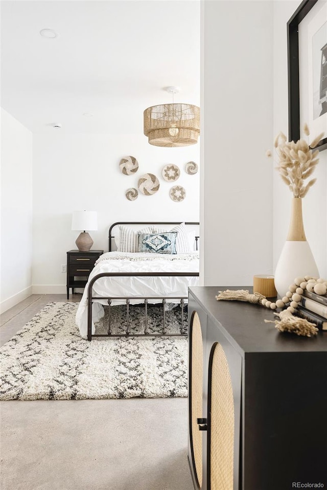 bedroom featuring baseboards