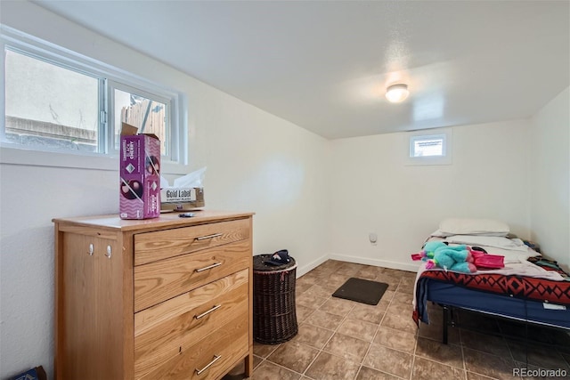 tiled bedroom with baseboards