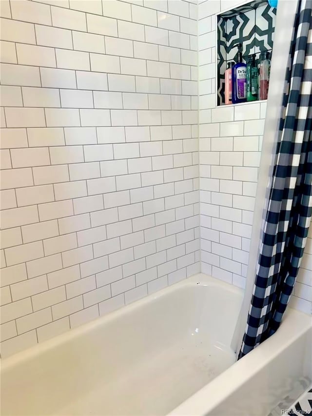 full bathroom with shower / bathtub combination with curtain