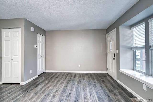 18131 E Arizona Ave Unit F, Aurora, CO 80017 - foyer entrance featuring wood finished floors and a textured ceiling