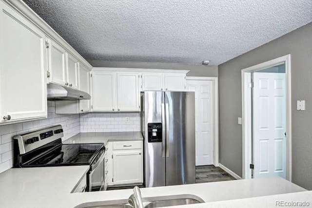 18131 E Arizona Ave Unit F, Aurora, CO 80017 - kitchen featuring appliances with stainless steel finishes, under cabinet range hood, light countertops, white cabinets, and a textured ceiling