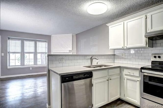 18131 E Arizona Ave Unit F, Aurora, CO 80017 - kitchen with appliances with stainless steel finishes, light countertops, a textured ceiling, tasteful backsplash, and dark wood finished floors